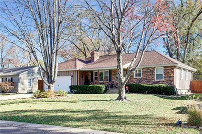 Single story home with a garage and a front yard | Image 2