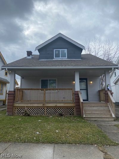 View of front facade with a front lawn and a porch | Image 1