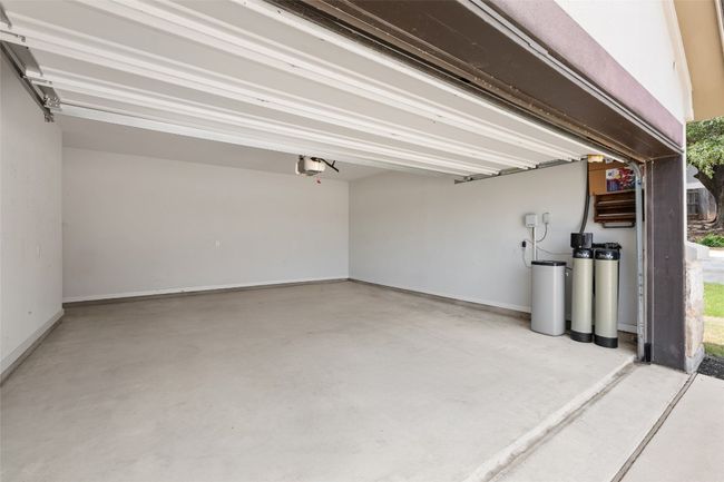 Garage with a garage door opener & Water softener for the whole house | Image 29