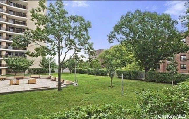 View of home's community with a lawn | Image 13