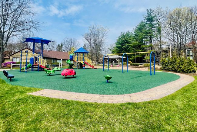 Community playground featuring a lawn | Image 28