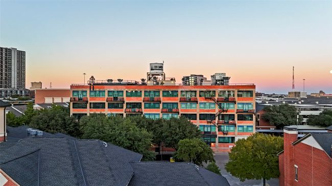 View of building exterior with a view of city | Image 4