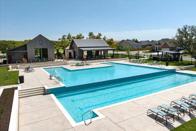 Community pool with a patio and fence | Image 12