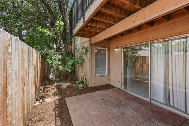 Fenced backyard featuring a patio area | Image 12
