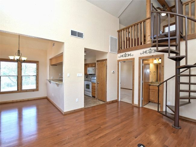 Note half bath off living room. (doorway to left of spiral stairs). | Image 7