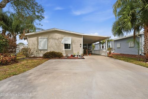 566 Dolphin Cir, Barefoot Bay, FL, 32976-2596 | Card Image