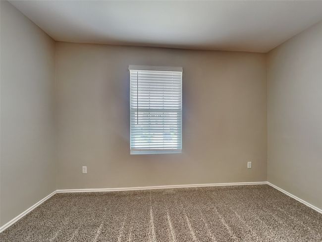 Carpeted empty room featuring baseboards | Image 8