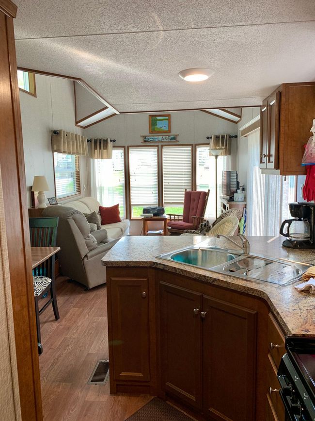 2021 Summit Park Model on beautiful large unit on "Playground Circle" in Cokato Lake RV Resort. Includes custom sun room, shed and more! | Image 24