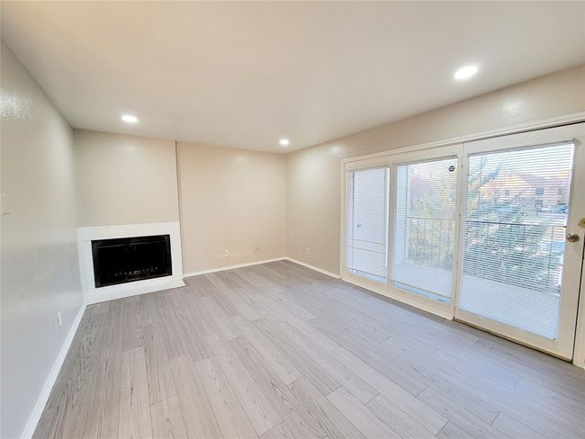 Unfurnished living room featuring light hardwood / wood-style flooring | Image 7