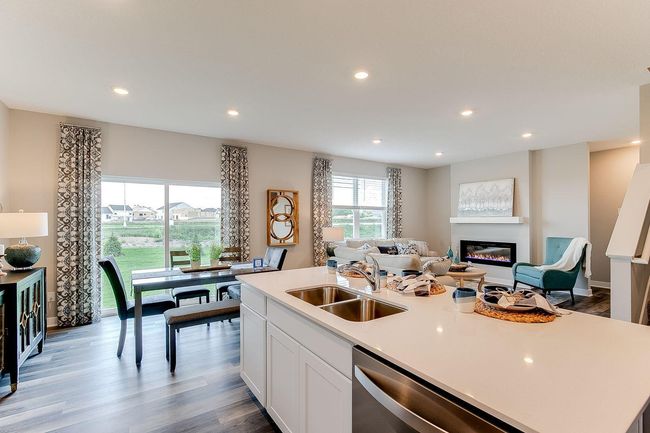 Large eating area off the kitchen is perfect for meals at any time of the day. Photo of model home, color & options may vary. | Image 4
