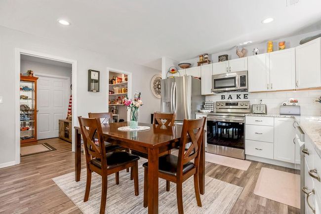 Dining space featuring light wood-style floors and recessed lighting | Image 12