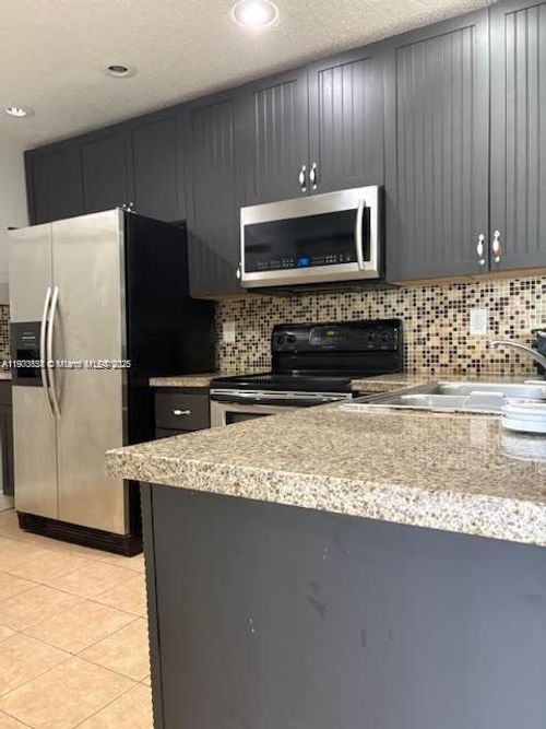 302b5-5721 Riverside Dr, Coral Springs, FL, 33067-2940 | Card Image