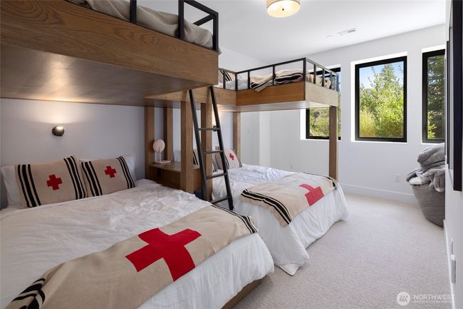 (6) twin beds over (2) queen beds in bunkroom. | Image 33