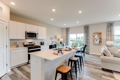 Kitchen will be upgraded with different cabinets, cabinet hardware, and white oversized tile backsplash. *photo of a model home, selections and finish will vary. | Image 2