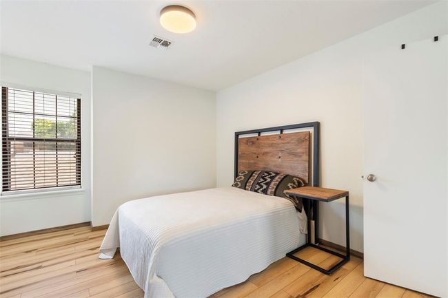 Bedroom featuring light wood finished floors and baseboards | Image 15