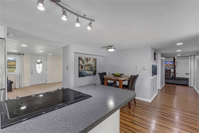 Eat in kitchen that is open to the living room & has access to the patio. | Image 6
