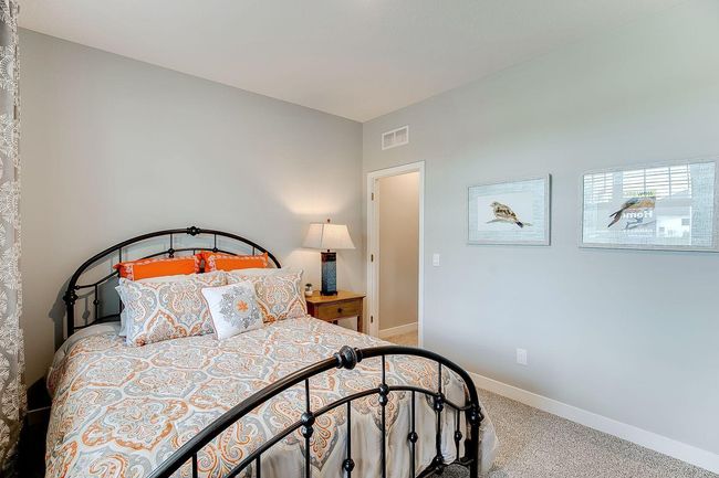 The Henley offers a highly sought after main floor bedroom! Photo of model home, color & options may vary. | Image 10