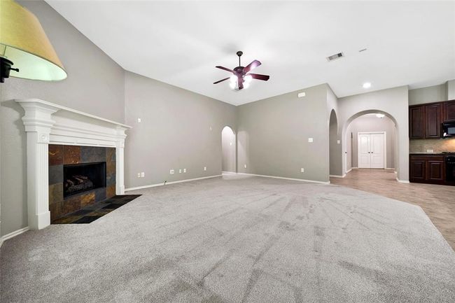 You'll love to cozy-up with the corner, gas-log fireplace. | Image 17