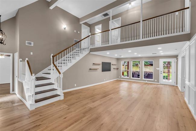 Luxurious new LVP flooring flow throughout the main living spaces and the primary bedroom suite. | Image 9