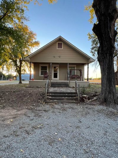 Bungalow-style home featuring covered porch | Image 1