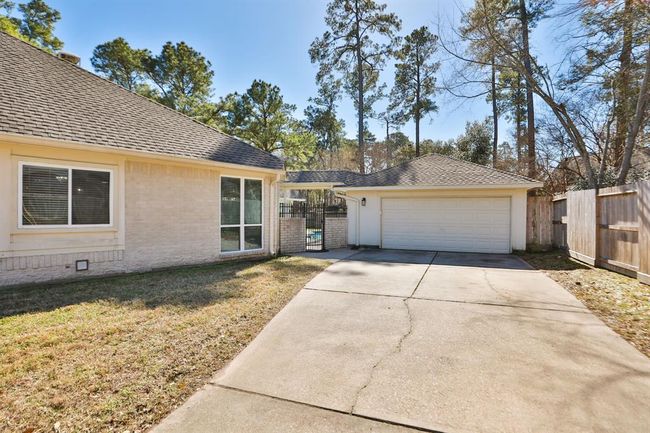 Oversized two car detached/attached garage with extra space and garage door opener. | Image 43