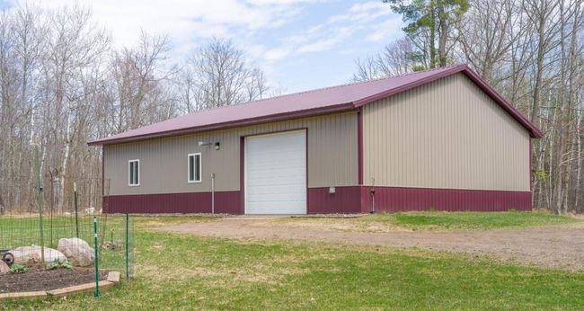 40 x 56 building has Heated Workshop (3) - 12 × 10 Ft Garage Doors (2 with openers) | Image 28