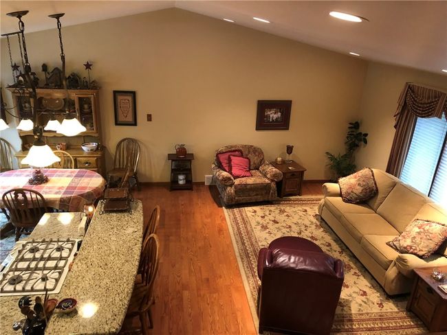 This room is perfect for a quiet family gathering or a fun party. Cathedral ceiling enhances the whole room. Beautiful hardwood floors | Image 4