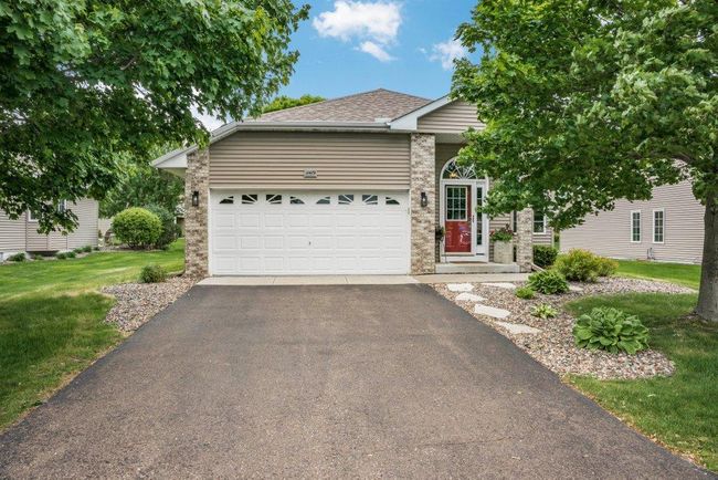 Welcome home to your stunning single-family home! Where sophistication, comfort, and warmth converge. Vinyl siding exterior with stone enhanced with tasteful landscaping. | Image 53