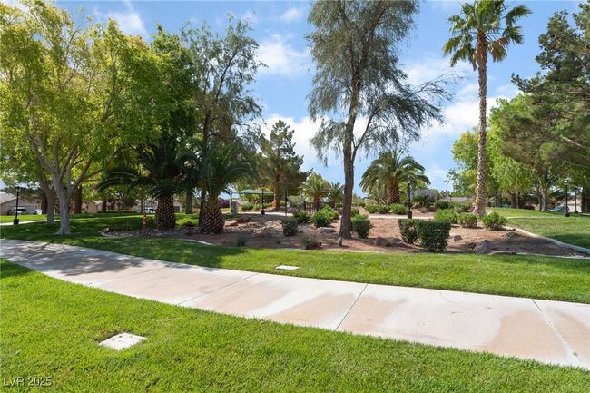 View of property's community with a lawn | Image 51