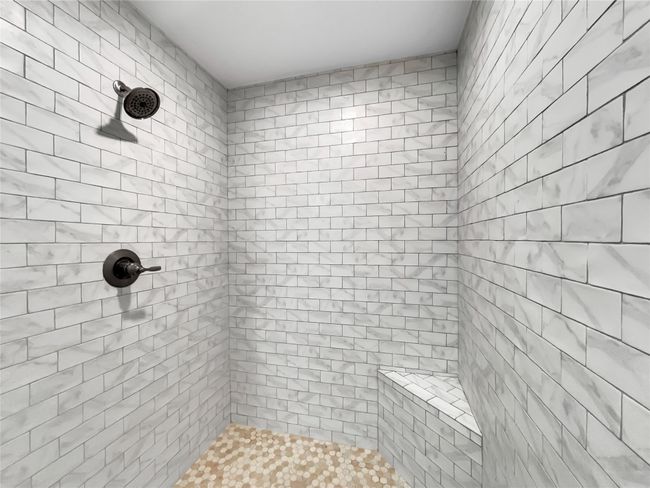 Bathroom featuring tiled shower | Image 5