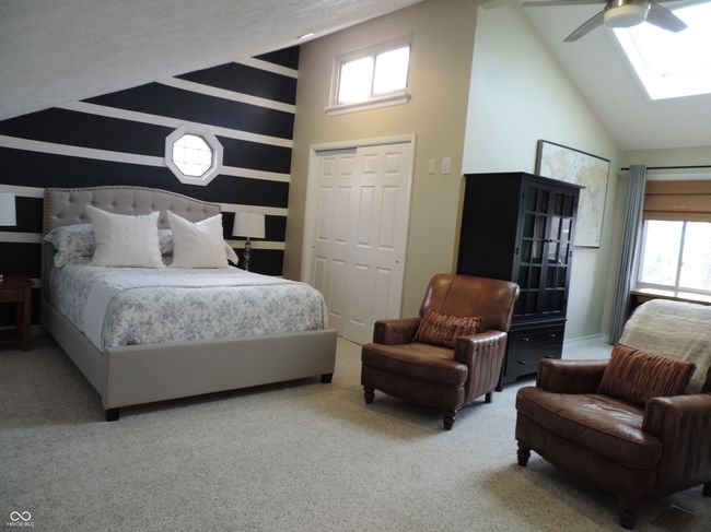carpeted bedroom with lofted ceiling | Image 16