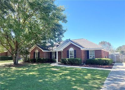 Ranch-style home featuring a front lawn | Image 1