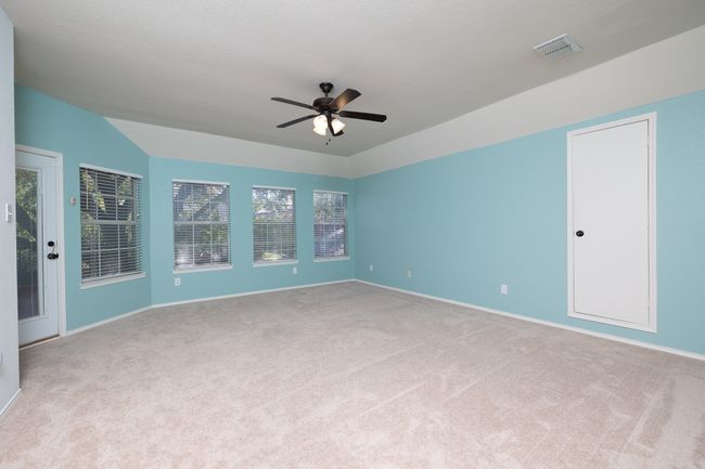 Empty room with ceiling fan and carpet floors | Image 27