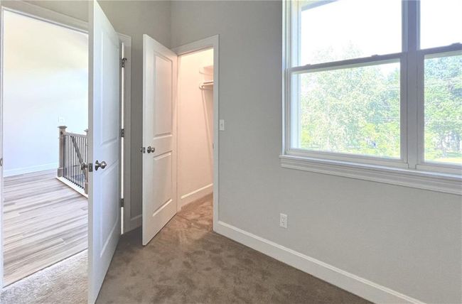 The main-floor primary bedroom even has a second closet! | Image 16