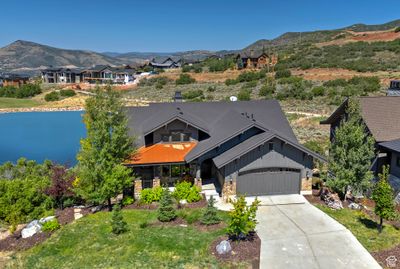 View of front of home with a mountain view and a garage | Image 2