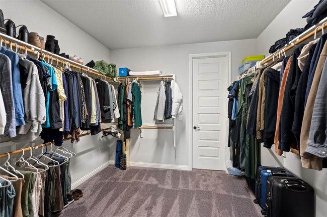 Walk in closet with carpet floors | Image 28