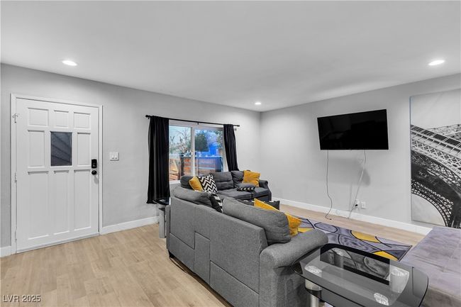 Living area featuring baseboards, recessed lighting, and light wood-style floors | Image 6