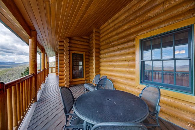 Wooden terrace with outdoor dining area and a mountain view | Image 39