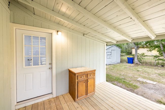 Deck featuring a shed, an outdoor structure, and fence | Image 34