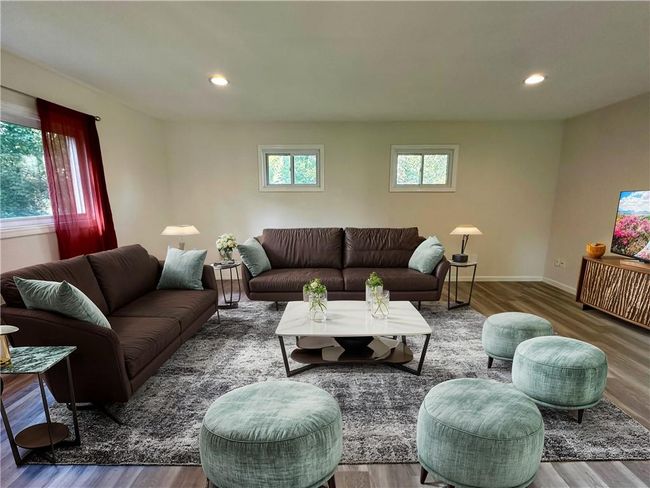 Virtually staged Living room with hardwood / wood-style floors | Image 8