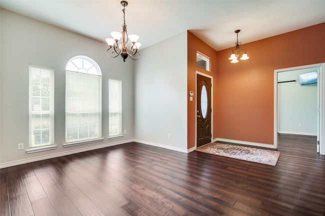 Foyer featuring a chandelier and dark wood-style floors | Image 6