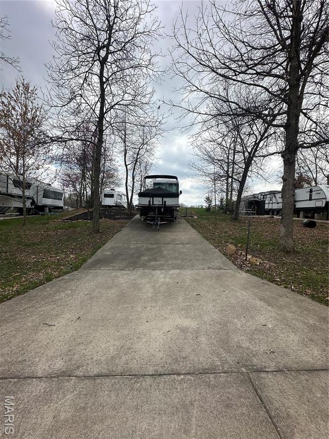 View of home's community with concrete driveway | Image 10