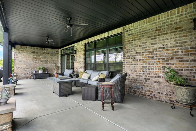 view of patio with ceiling fan and an outdoor living space | Image 40