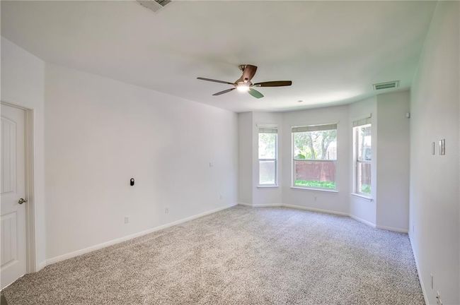 Spare room with light colored carpet and ceiling fan | Image 16