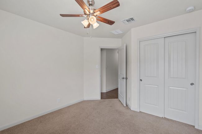 Bedroom 3 -- closet and ceiling fan | Image 20