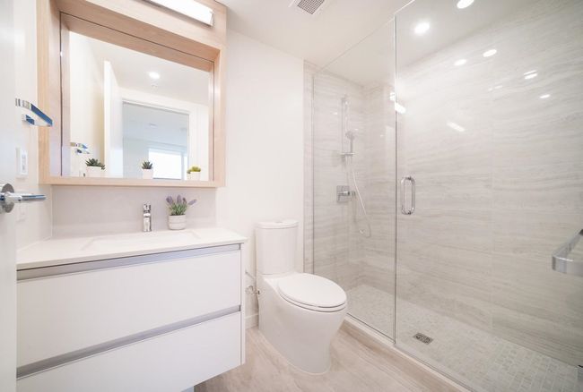 Full bath featuring a stall shower and vanity | Image 13