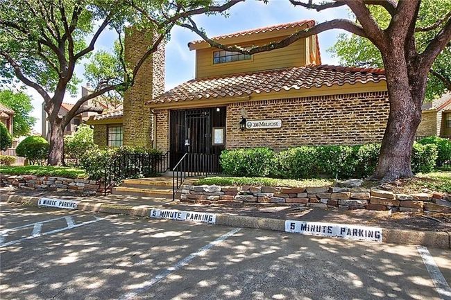 View of front of house with brick siding, uncovered parking, and a tile roof | Image 18