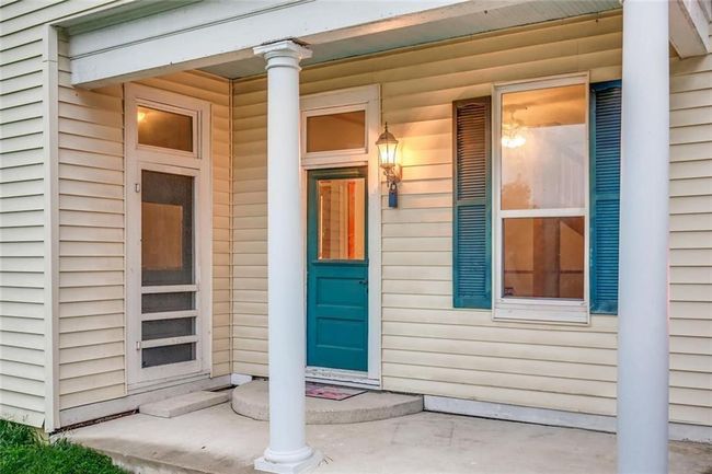Doorway to property with covered porch | Image 26