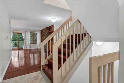 View from the entry through the Dining Room and Living Room. Note those gorgeous Brazilian Cherry floors. | Image 3