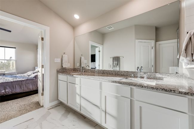 Full bathroom with double vanity, ensuite bath, marble finish flooring, and baseboards | Image 22